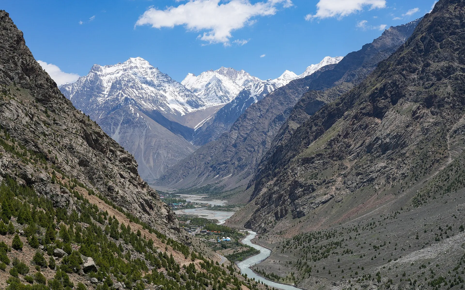 MadTrek mountaineer on a high Himalayan trail with a backpack